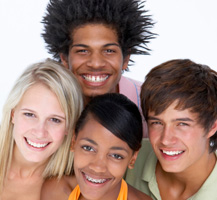 4 teenagers posing for a picture